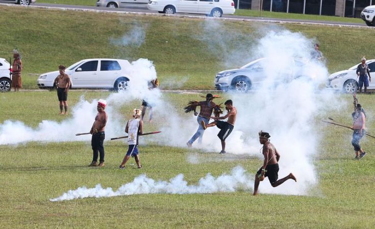 Indigenous leaders tear-gassed by police in front of Brazil’s National Congress this week. Photo: Wilson Dias courtesy of Agencia Brasil