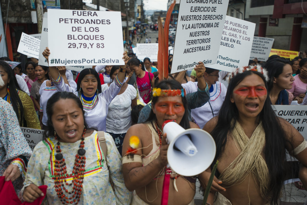 Alicia Cawiya (front centre, with megaphone), Patricia Nenquihui, Patricia Gualinga (rear left, holding sign), and Katy Betancourt. International Women’s Day March, Puyo, Ecuador, 8 March 2016. © Mike Reich 2016