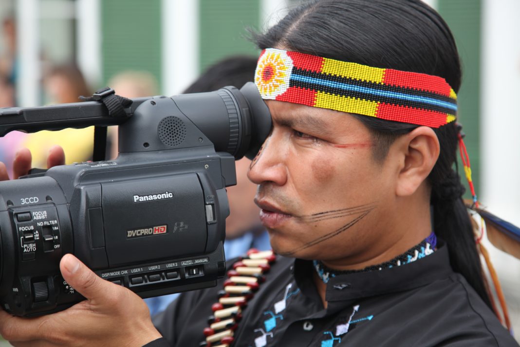 Eriberto Gualinga, Sarayaku member and videomaker, Ecuador (at the Inter-American Court of Human Rights, Costa Rica, July 2011). © Zoë Tryon 2011 / Photograph reproduced courtesy of Amnesty International The Indigenous Kichwa People of Sarayaku (Pueblo Originario Kichwa de Sarayaku) of Ecuador is campaigning for their right to be consulted, including their right to consent, regarding development projects that affect them. Some time ago, the government authorized a company to enter their ancestral land and drill for oil without having consulted with Sarayaku beforehand. Sarayaku’s case is representative of the case of many other Indigenous communities across the Americas. But they have gone a step farther. Having exhausted all judicial avenues at home, they have taken their case to the Inter-American Court of Human Rights. The Court’s forthcoming ruling will send a strong message to the Ecuadorian government and to all governments across the region. Amnesty International is supporting Sarayaku’s campaign to defend their own rights and the rights of many other communities across the Americas. Governments must consult with Indigenous people before carrying out development projects which may affect their lives.