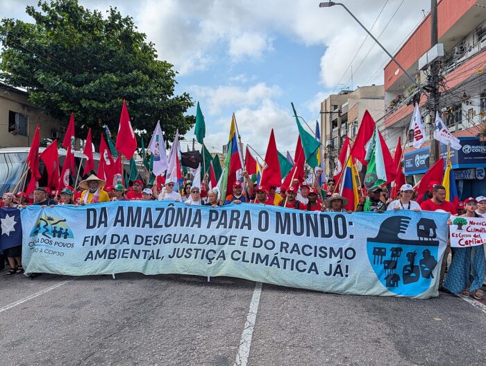 Protesters gather near the COP30 venue in Belém, calling for stronger action to protect the Amazon and Indigenous land rights.